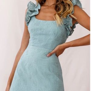 Teal ruffle shoulder mini dress. Embroidered cotton fabric and ruffle shoulders